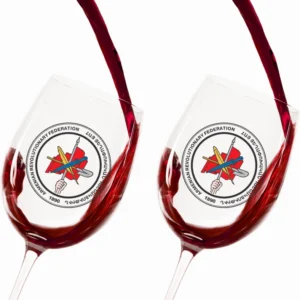 Close-up of ARF logo wine glasses filled with red wine.